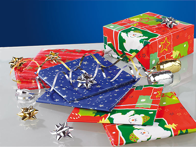 Emballage et papier cadeau de Noël avec ruban et noeud or et argent 